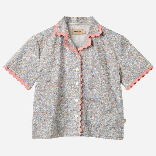 Sold at Bombon Shop, designed by Wheat, air blue flowers organic cotton short sleeve blouse with lace trim and soft blue floral print.