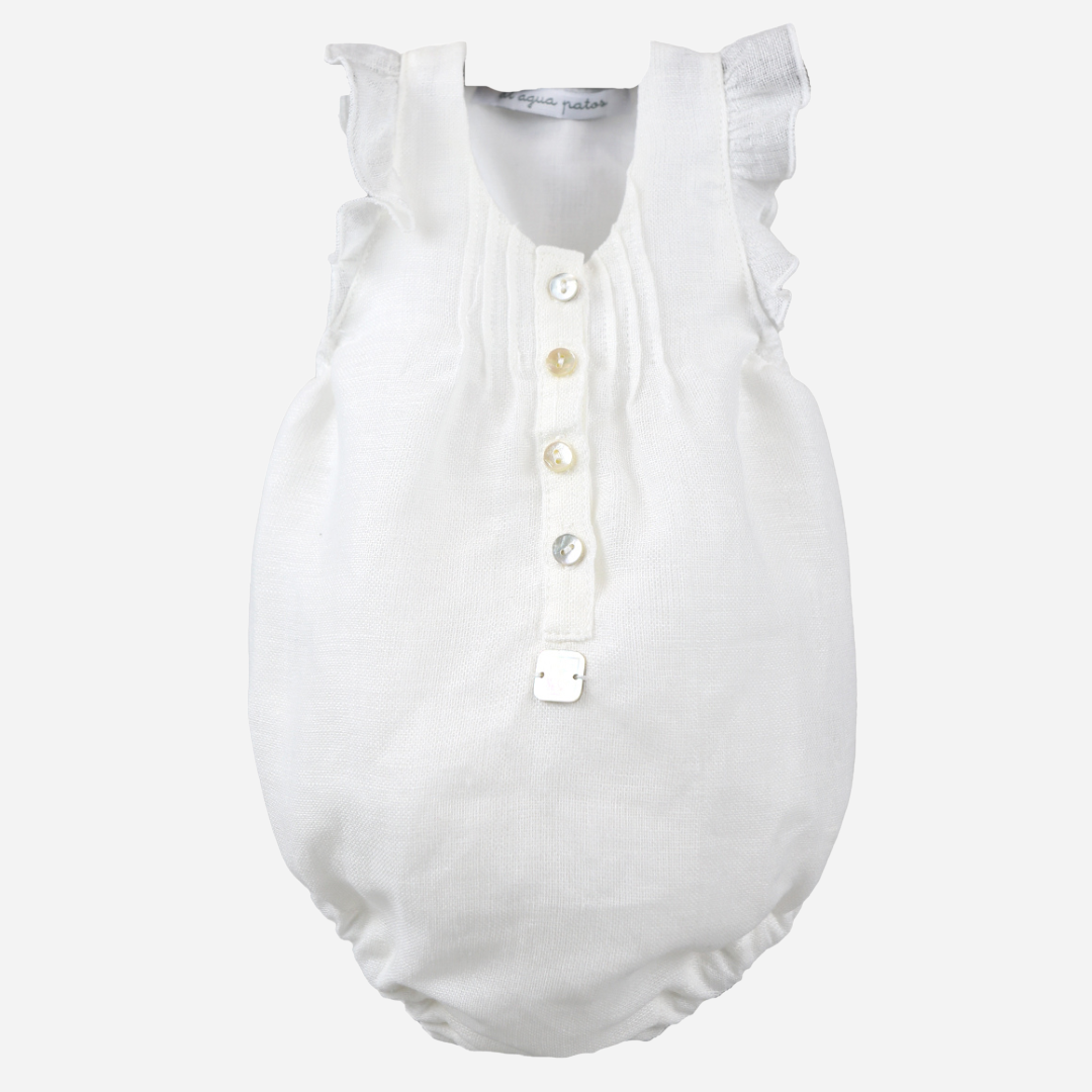 sold at Bombon shop, designed by al agua patos brand, this white linen romper for baby girls is ideal for spring and summer. front view 