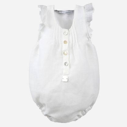 sold at Bombon shop, designed by al agua patos brand, this white linen romper for baby girls is ideal for spring and summer. front view 