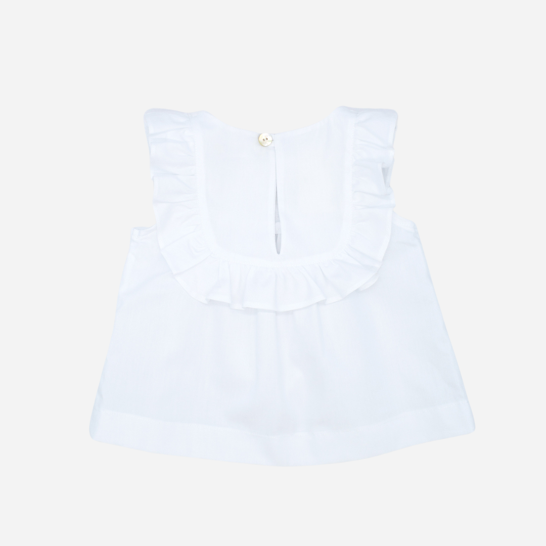 Sold at Bombon shop, designed by Fina Ejerique brand, white embroidered voile blouse is perfect for spring and summer. back view