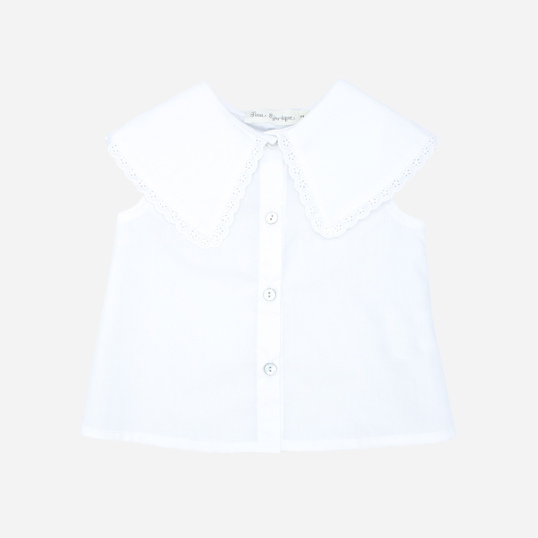 Sold at Bombon shop, designed by Fina Ejerique brand, white poplin collar blouse for babies and toddlers is perfect for spring and summer. front view