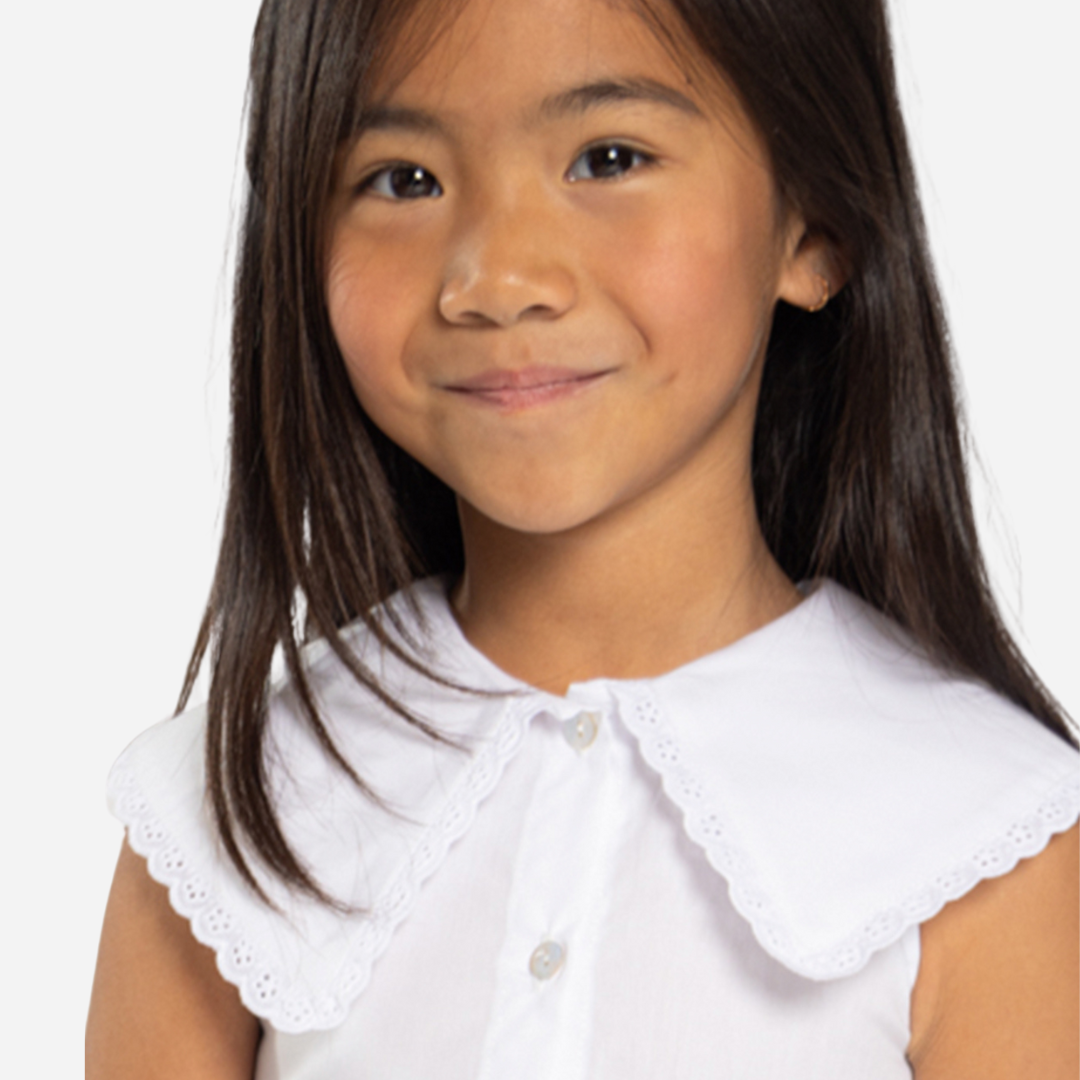 Sold at Bombon shop, designed by Fina Ejerique brand, white poplin collar blouse for babies and toddlers is perfect for spring and summer. model view