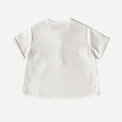 sold at Bombon shop, designed by Paloma de la O brand, this white shirt for baby boys and toddlers is perfect to complete any spring and summer outfit. back view