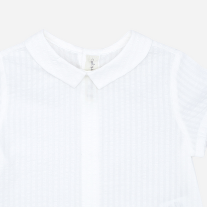 Sold at Bombon shop, designed by Fina Ejerique brand, white short sleeved baby shirt perfect for spring and summer. Zoom view