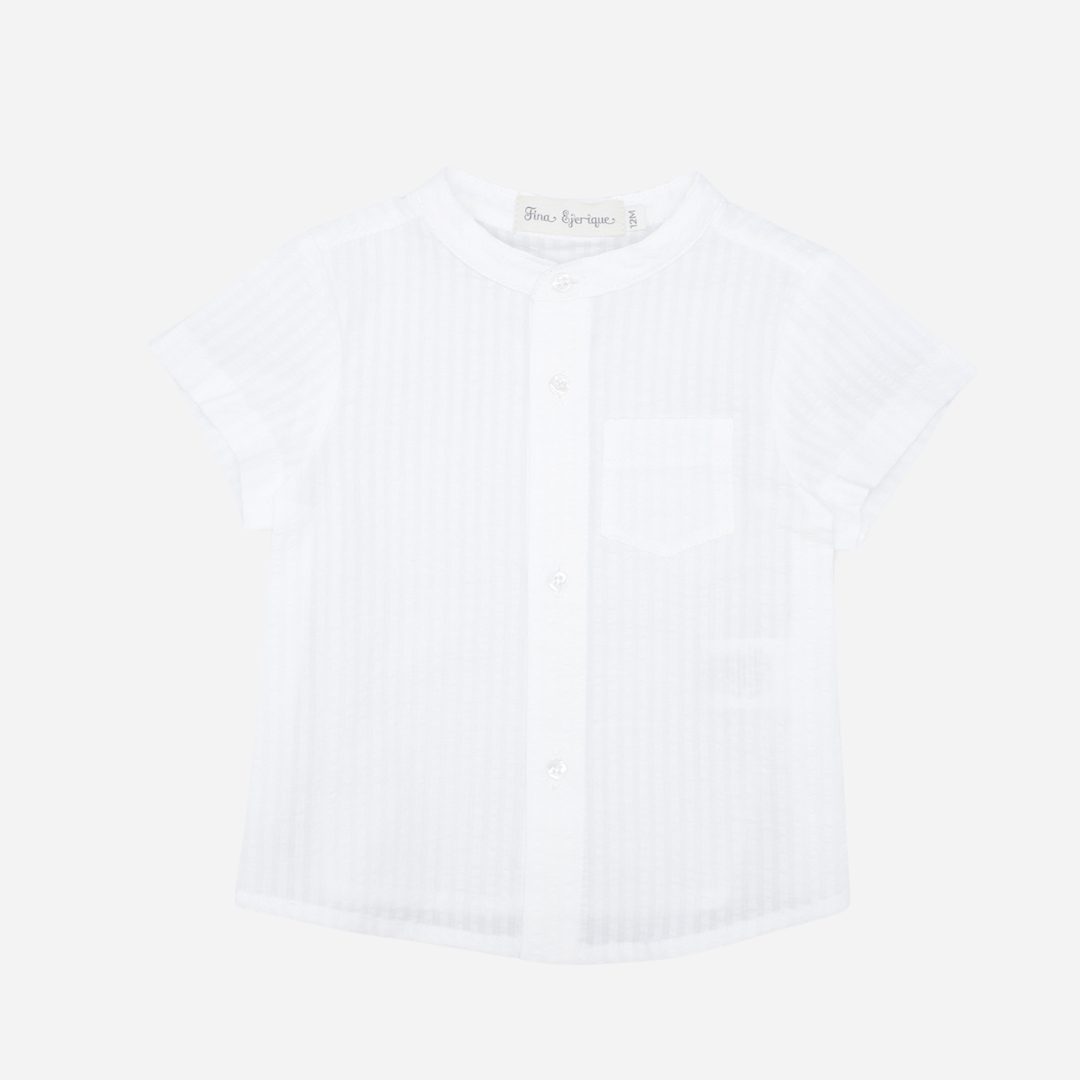 Sold at Bombon shop, designed by Fina Ejerique brand, white short sleeve shirt for babies and toddlers perfect for spring and summer. Front view