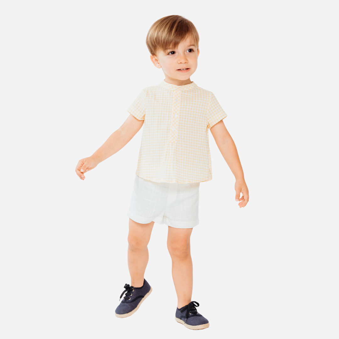 sold at Bombon shop, designed by fina ejerique brand, white twill bermuda shorts for toddlers are perfect for spring and summer. model view