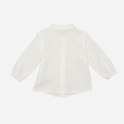 Sold at Bombon shop, designed by Fina Ejerique, a white viyella baby shirt with rounded collar, wooden buttons, and long sleeves. back