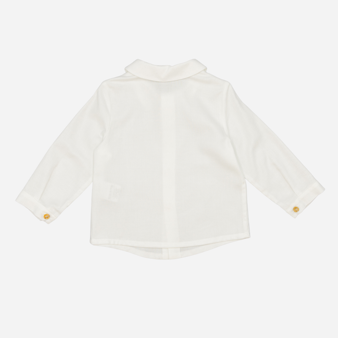 Sold at Bombon shop, designed by Fina Ejerique, a white viyella baby shirt with rounded collar, wooden buttons, and long sleeves. back