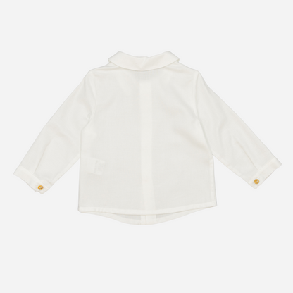 Sold at Bombon shop, designed by Fina Ejerique, a white viyella baby shirt with rounded collar, wooden buttons, and long sleeves. back