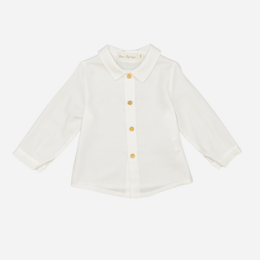 Sold at Bombon shop, designed by Fina Ejerique, a white viyella baby shirt with rounded collar, wooden buttons, and long sleeves. front