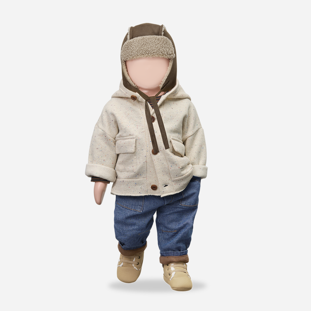 Sold at Bombon shop, designed by 1+ in the family – William baby pants in soft denim with front pockets, elastic waistband, and brown fleece-lined cuffs. mannequin