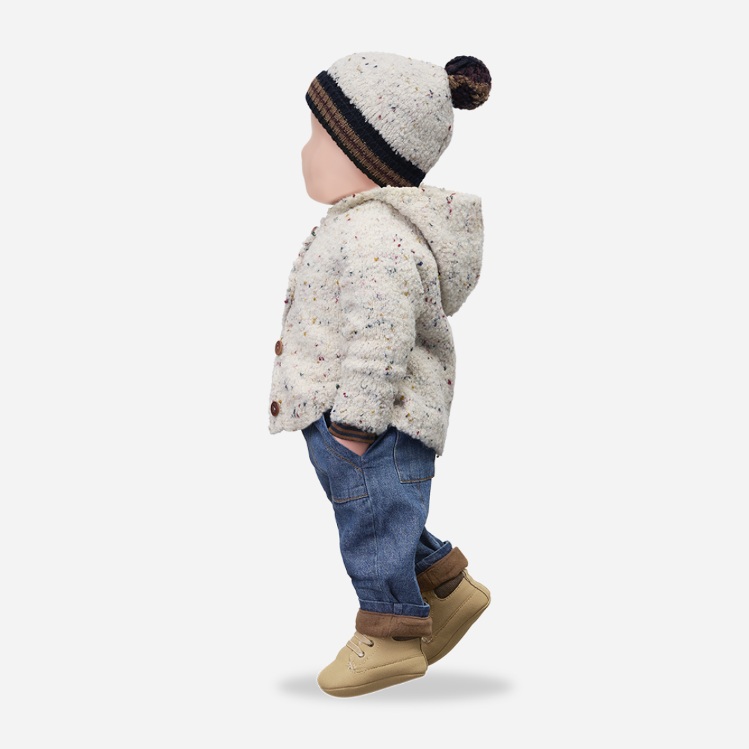 Sold at Bombon shop, designed by 1+ in the family – William baby pants in soft denim with front pockets, elastic waistband, and brown fleece-lined cuffs. mannequin
