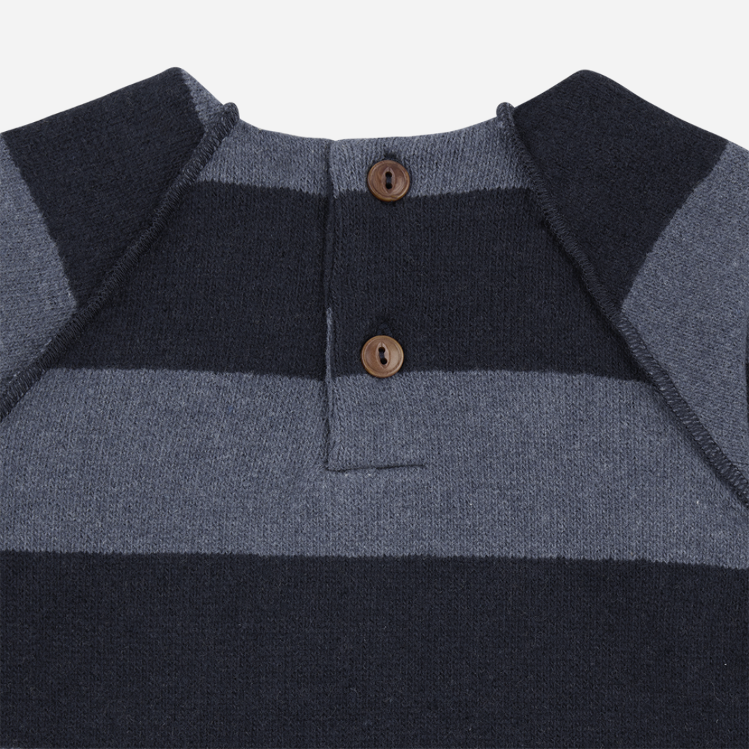Sold at Bombon shop, designed by 1+ in the family – navy and grey striped baby jumpsuit with long sleeves and soft fabric, shown flat on white background zoom