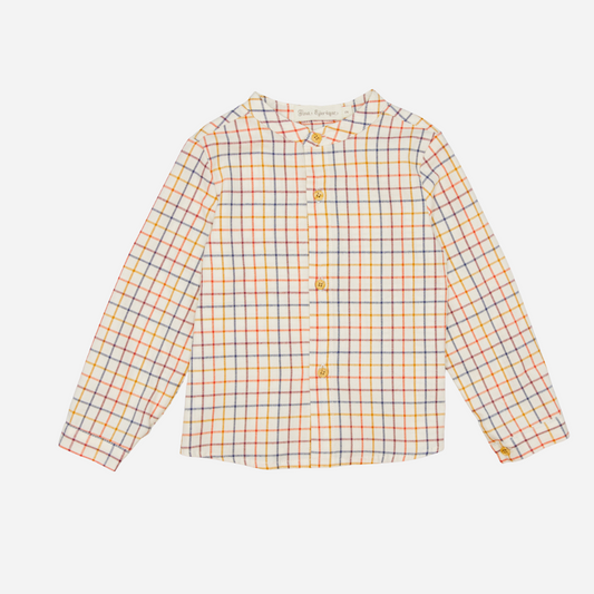 Sold at Bombon shop, designed by Fina Ejerique, a beige viyella baby shirt with red, mustard, and blue checkered pattern, wooden buttons, and long sleeves. front