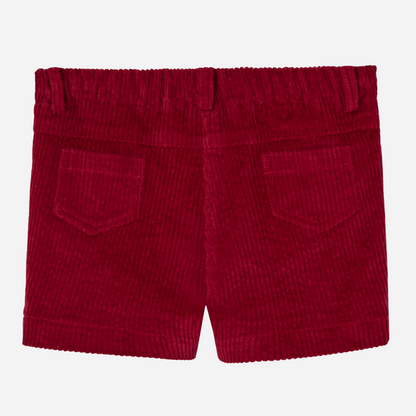 Sold at Bombon shop, designed by Paz Rodriguez, red corduroy boys' shorts with front pockets and wooden button