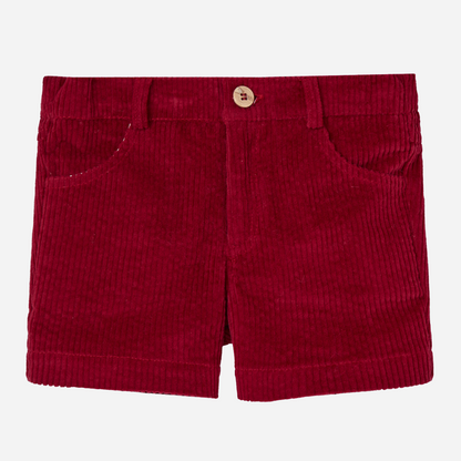 Sold at Bombon shop, designed by Paz Rodriguez, red corduroy boys' shorts with front pockets and wooden button