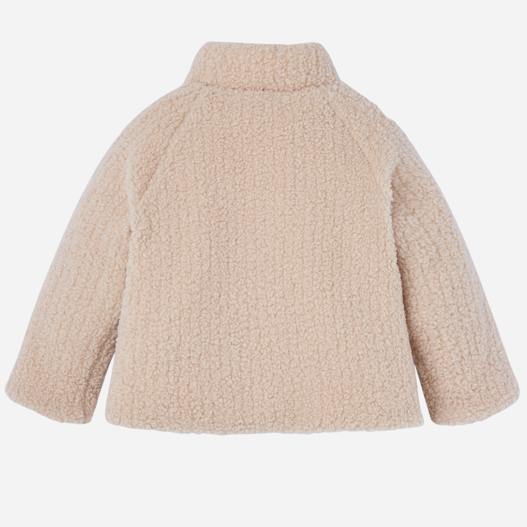 Sold at Bombon shop, designed by Paz Rodriguez, cream sherpa-style baby jacket with wooden buttons and front patch pockets