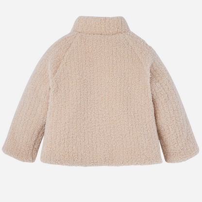 Sold at Bombon shop, designed by Paz Rodriguez, cream sherpa-style baby jacket with wooden buttons and front patch pockets