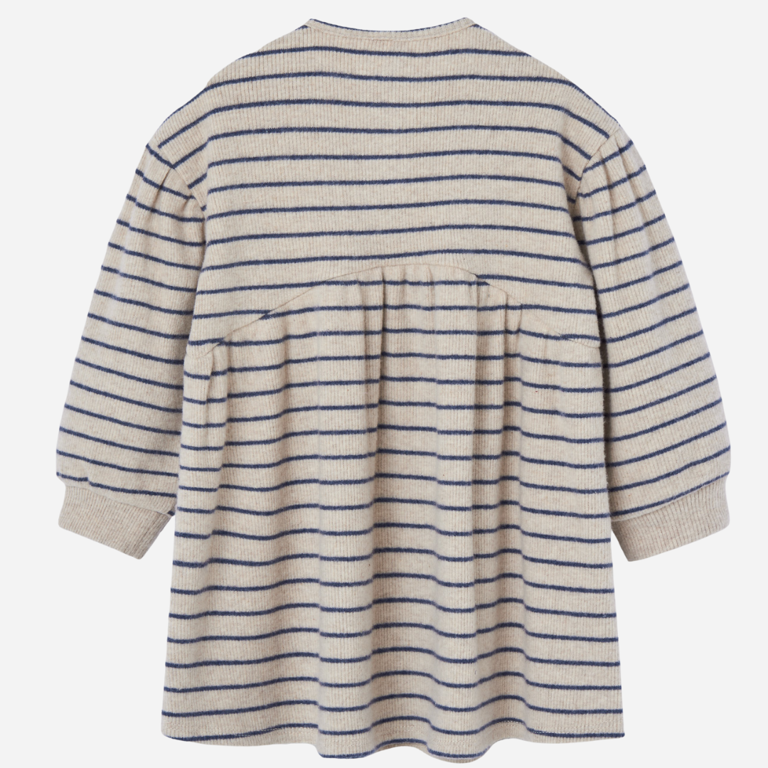 Sold at Bombon shop, designed by Paz Rodriguez, cream and navy striped knit dress with gathered waist and three-button front.