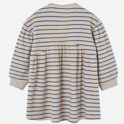 Sold at Bombon shop, designed by Paz Rodriguez, cream and navy striped knit dress with gathered waist and three-button front.