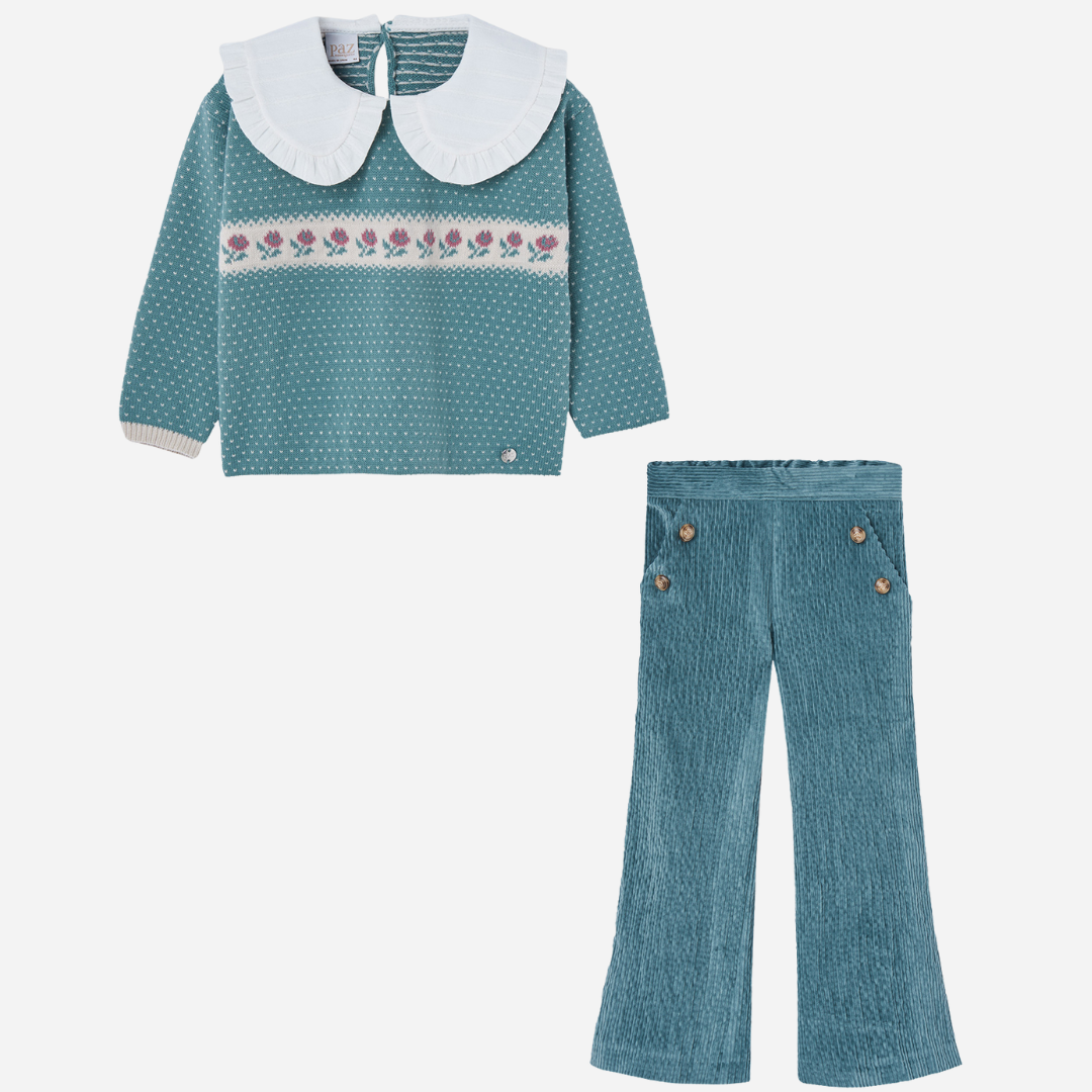 Sold at Bombon shop, designed by Paz Rodriguez, teal knit sweater with floral embroidery and ruffled white collar, paired with matching teal corduroy flared pants.