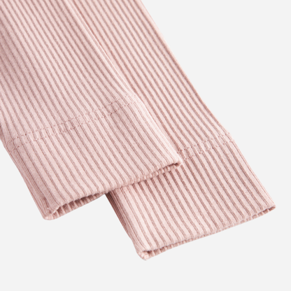 Sold at Bombon shop, designed by MarMar Copenhagen — blush pink ribbed organic cotton baby leggings, part of a matching set.