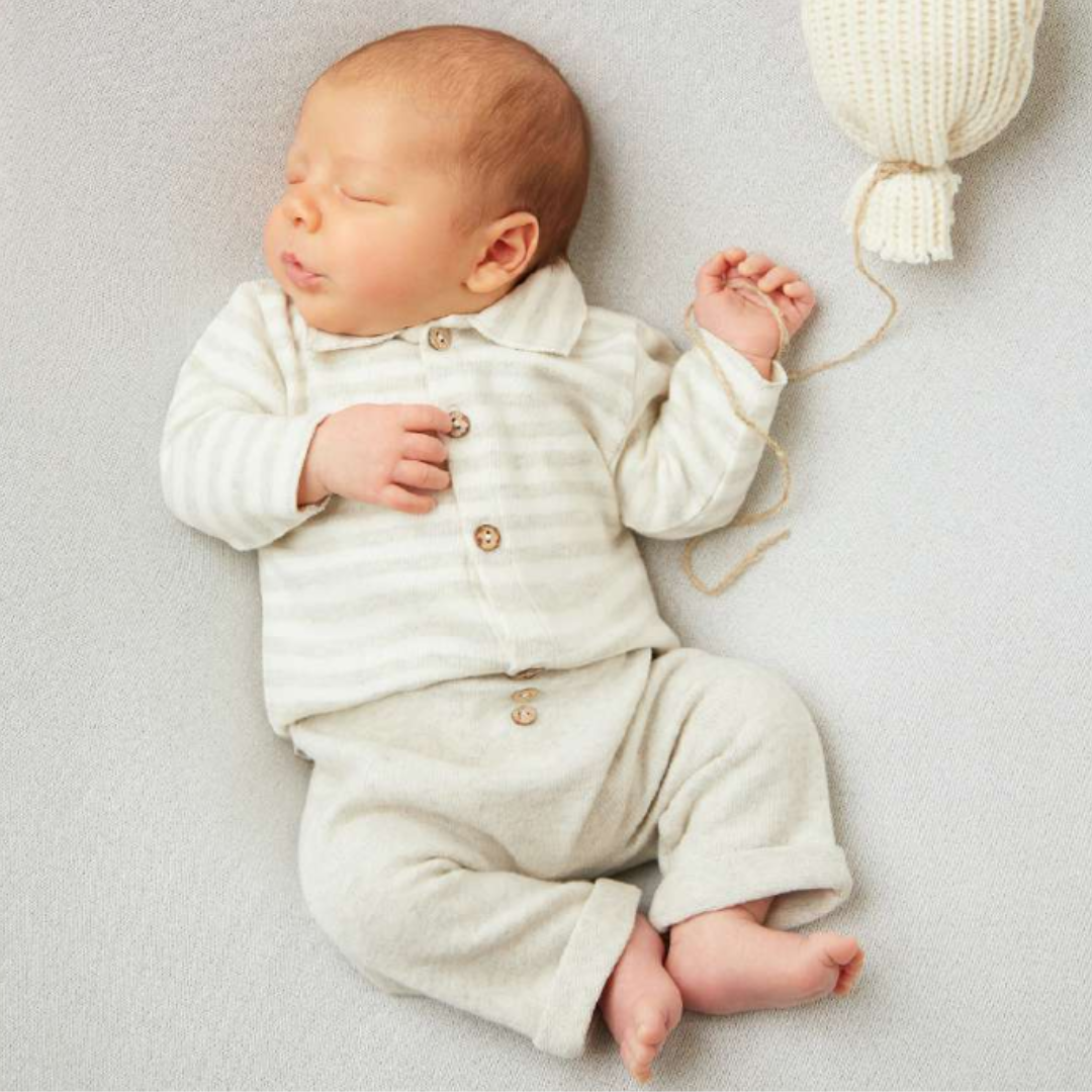 Sold at Bombon shop, designed by Tiny Soul — baby button-down shirt in grey and white stripes with collar and front buttons. model view