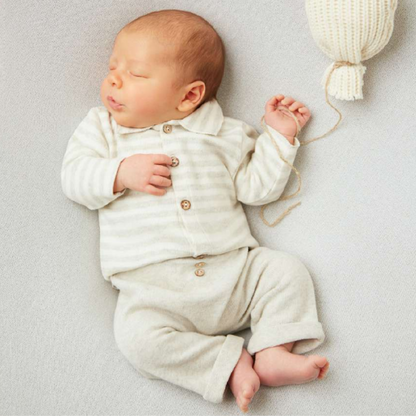 Sold at Bombon shop, designed by Tiny Soul — baby button-down shirt in grey and white stripes with collar and front buttons. model view